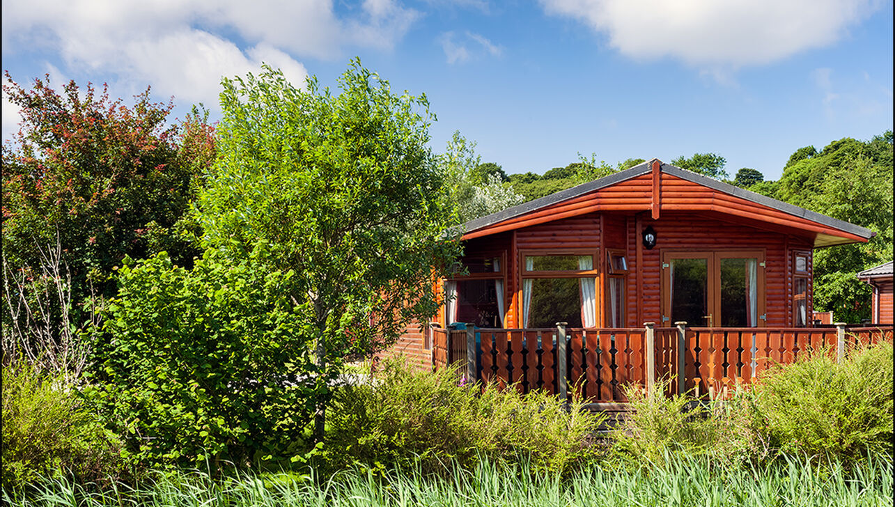 luxury lodges by the river at  River Valley Country Park