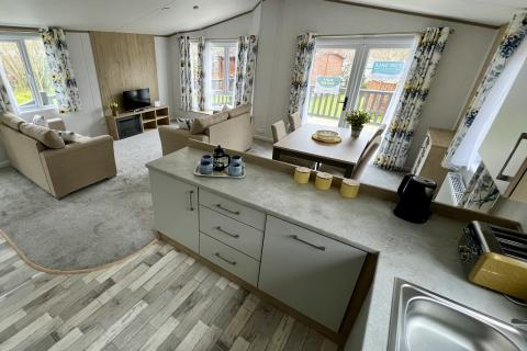 Lounge, Kitchen & Dining Area in a Luxury Lodge