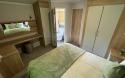 Master Bedroom in a Caravan Holiday Home with an Ensuite
