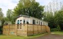 Outside of static caravan with wooden decking