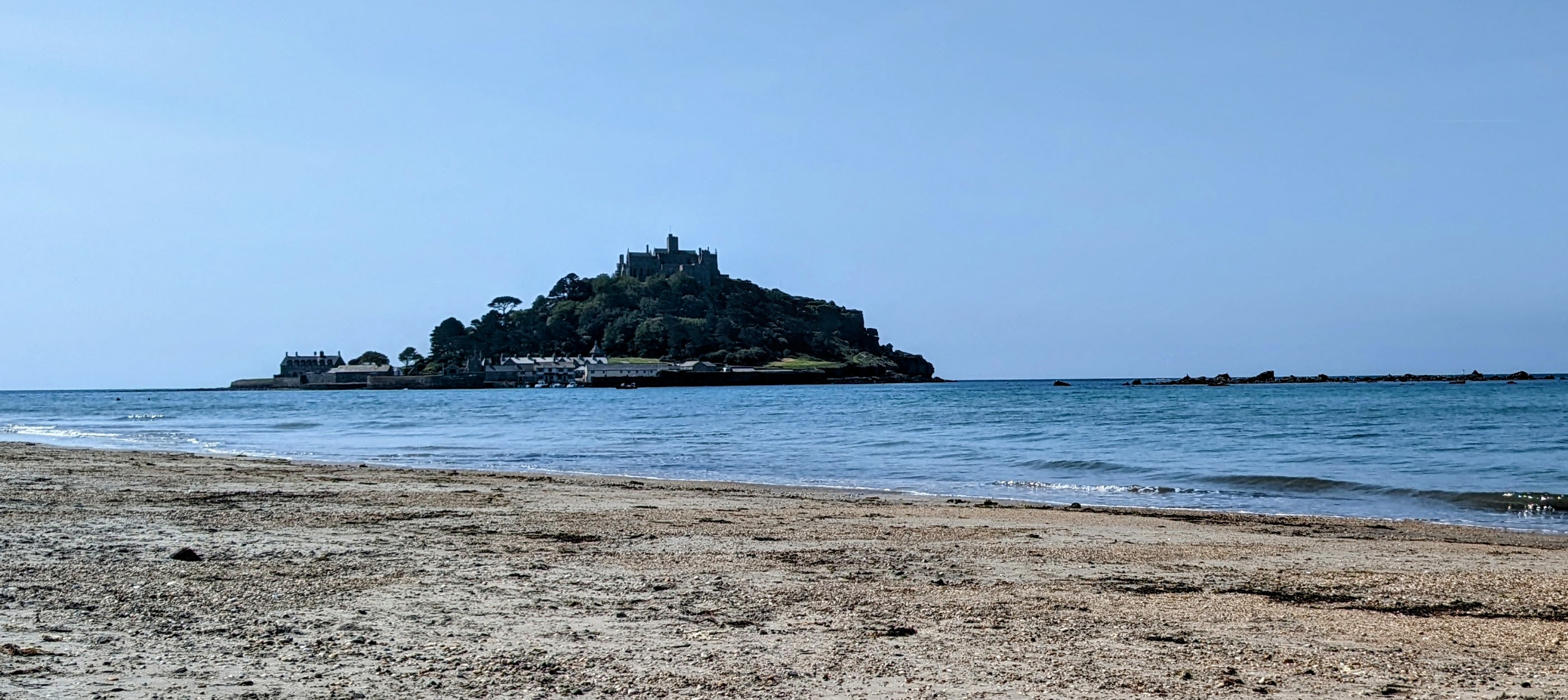 St Michael's Mount with blue sky and beach