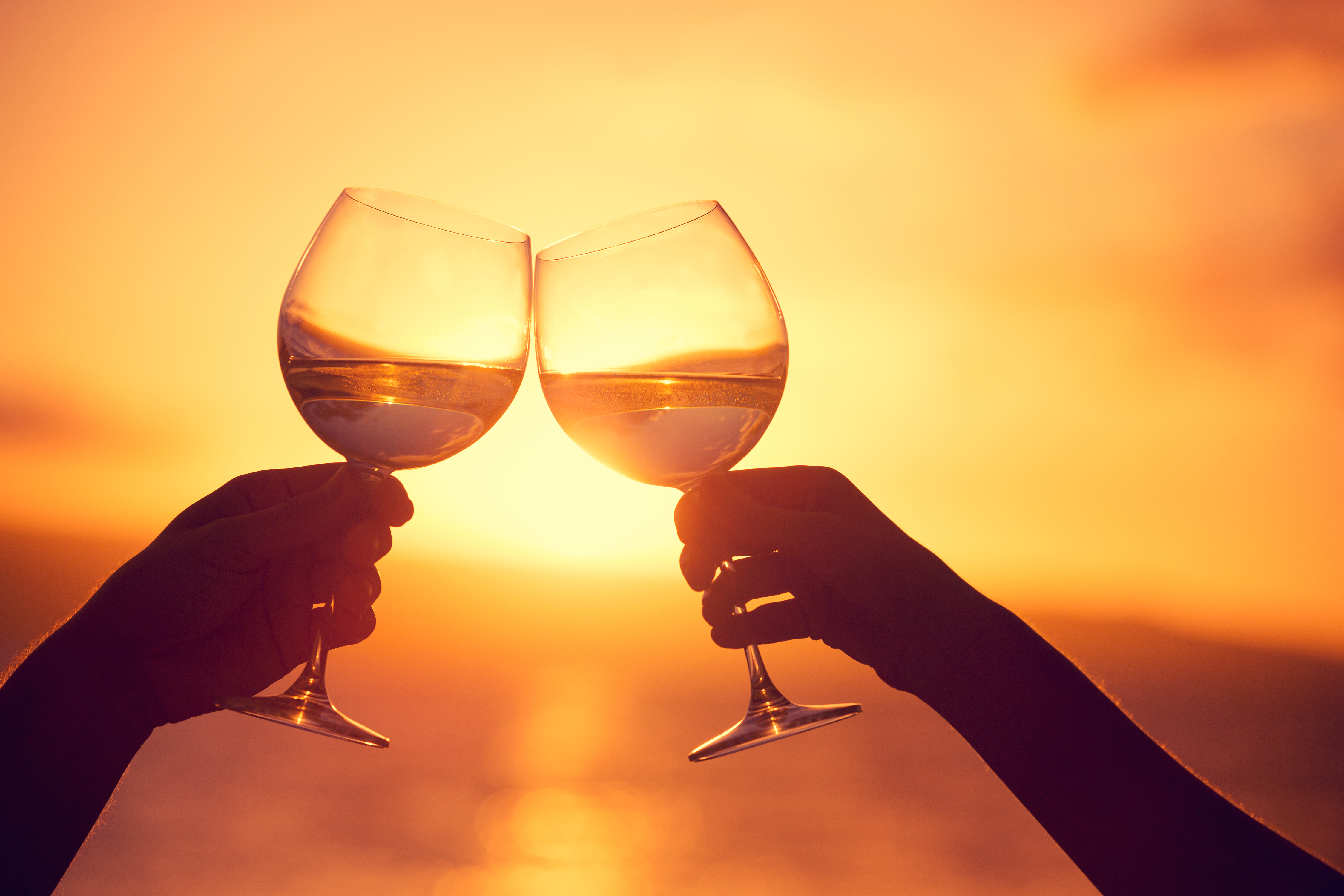 Wine glasses at sunset