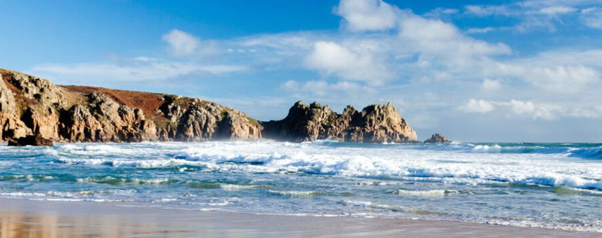 A Cornish Sandy Beach with Rugged Cliffs