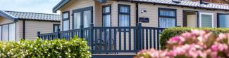 Holiday Homes surrounded by bright Flowers on a North Devon Holiday Park