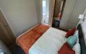 Master Bedroom in a Caravan Holiday Home with an Ensuite