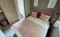 Master Bedroom in a Caravan Holiday Home with an Ensuite