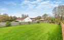 Outdoor View of Cottage in Beautiful Gardens
