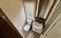 Bathroom with shower, toilet and sink.