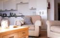 Lounge, Kitchen & Dining Area in a Luxury Lodge