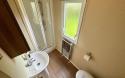 Bathroom with shower, sink and toilet.