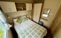 Interior view of master bedroom with double bed. 