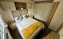Master bedroom with double bed and built in wardrobes.
