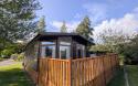 Exterior of wooden lodge with decking 